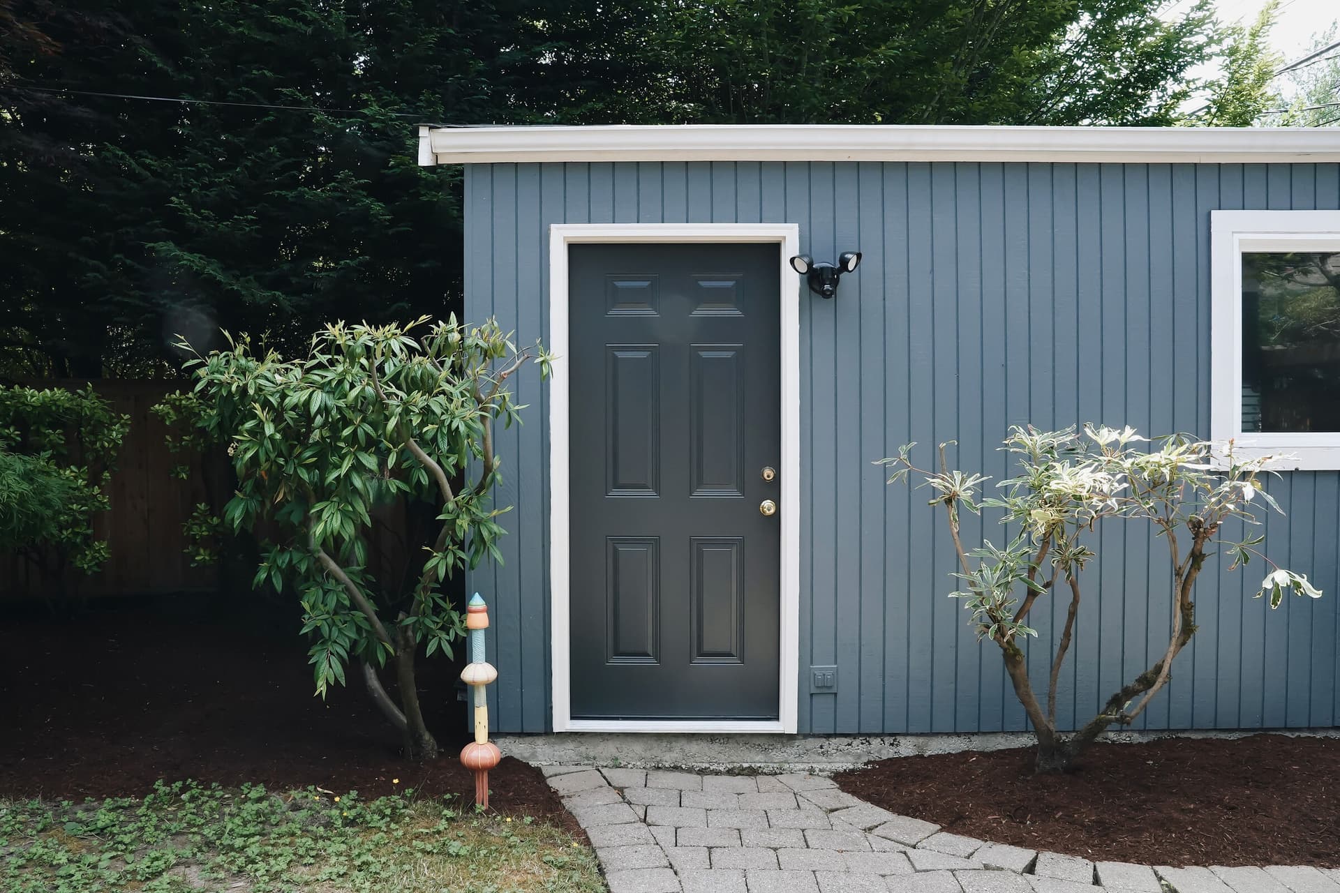 Freshly repainted blue-gray exterior of a Mercer Street home in Seattle by Strata Coating